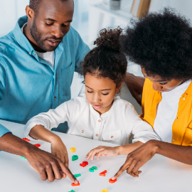 parents teaching daughter